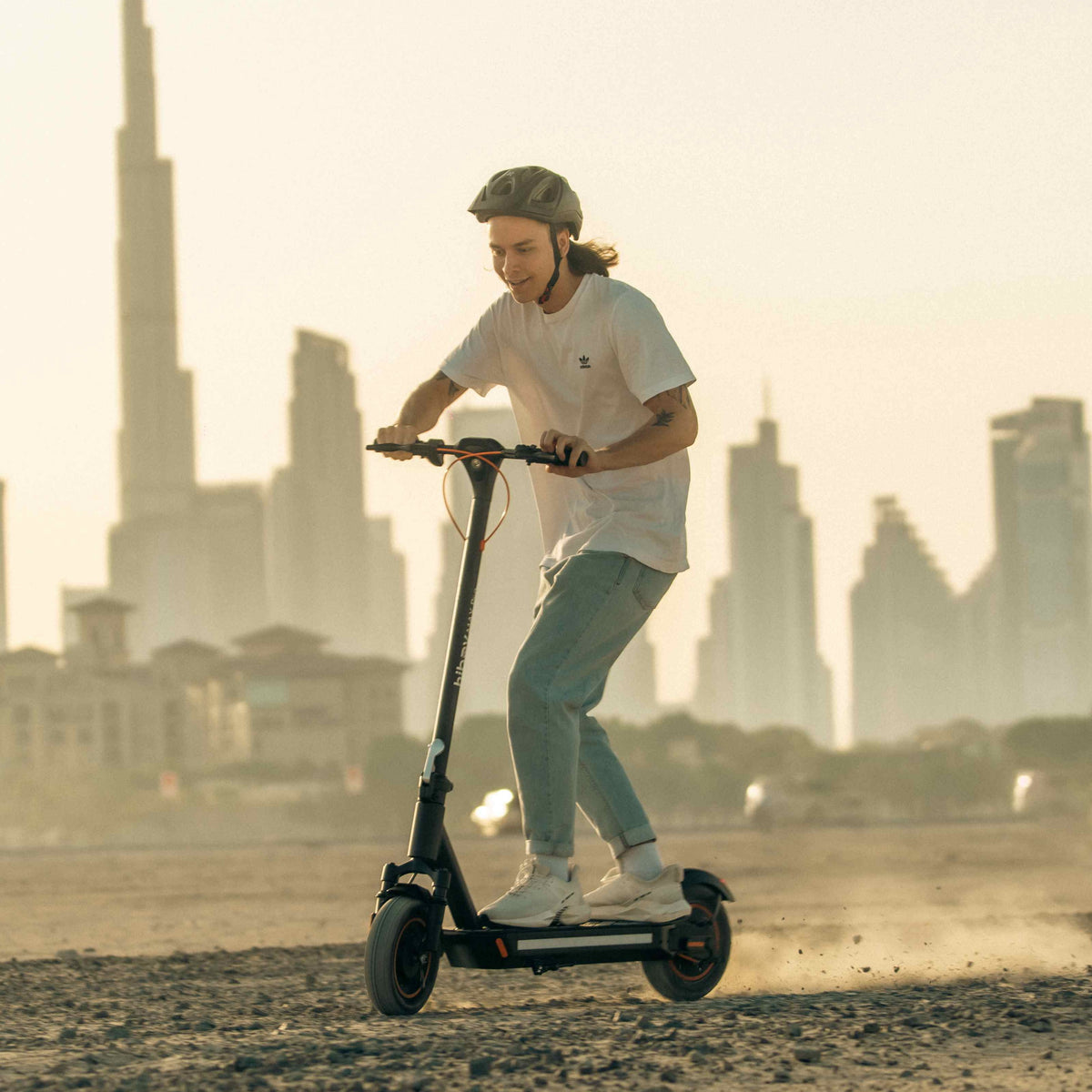 A rider taking a break beside a Hiboy electric scooter